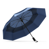 The Navy Blue Top Best-Selling Windproof Compact Travel Umbrella is pictured on it's own, open and leaning to the left.