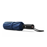 An image of a closed, navy blue colored travel Repel umbrella.