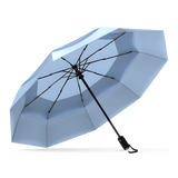 The Slate Blue Top Best-Selling Windproof Compact Travel Umbrella is pictured on it's own, open and leaning to the left.